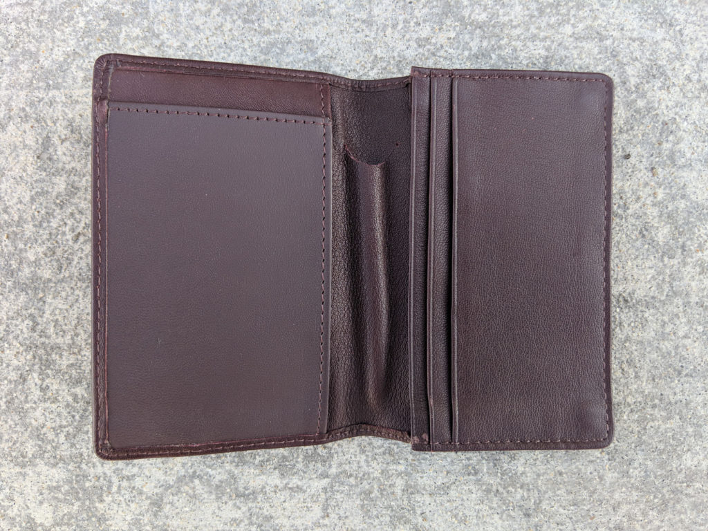 Brown wallet opened showing it's empty